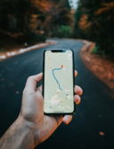 person holding white iphone 5 c